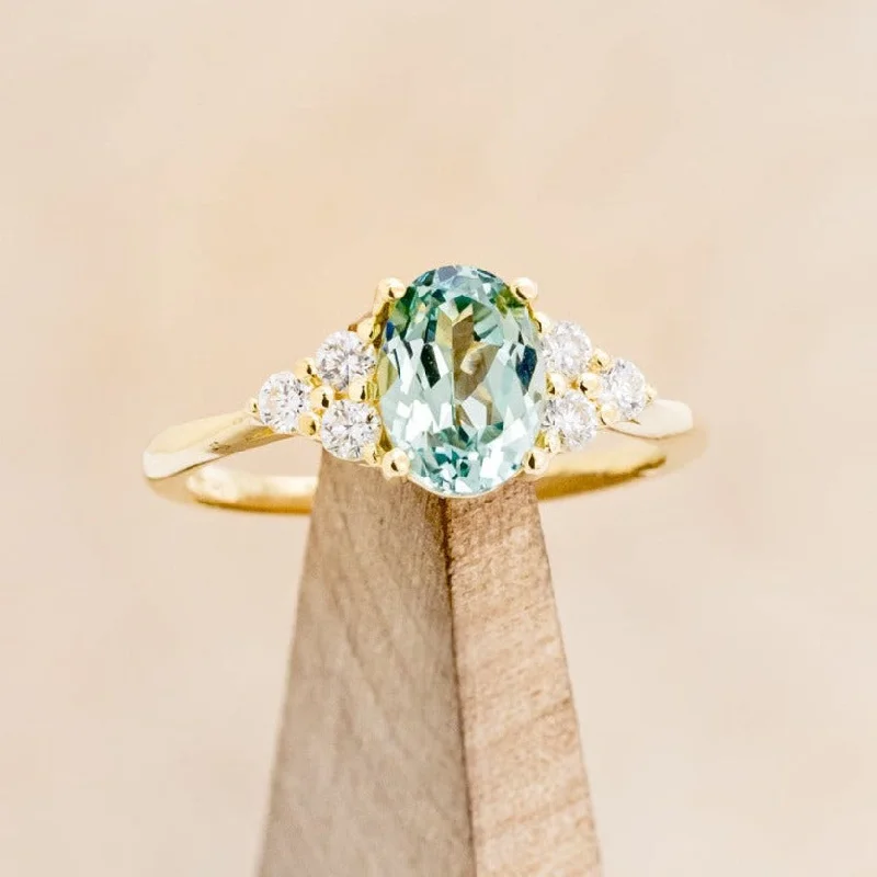 "RHEA" - OVAL CUT LAB-GROWN GREEN SAPPHIRE ENGAGEMENT RING WITH DIAMOND ACCENTS